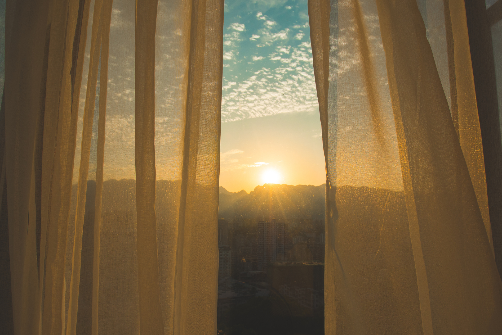 Open curtains with morning sun.