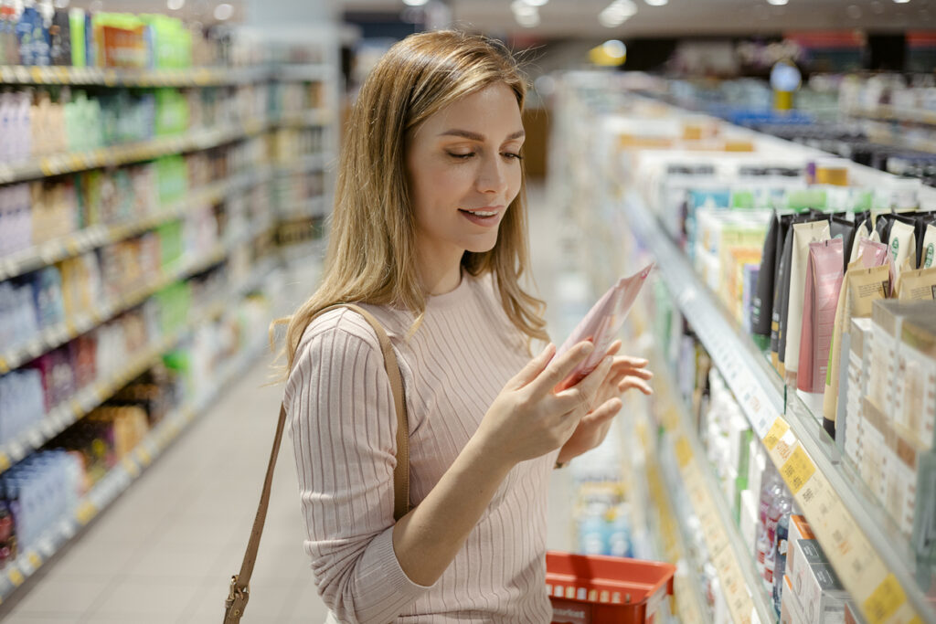 Woman shopping for clean skincare products. 